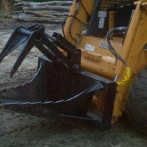 Case 1845C Stump bucket w grapple.jpg